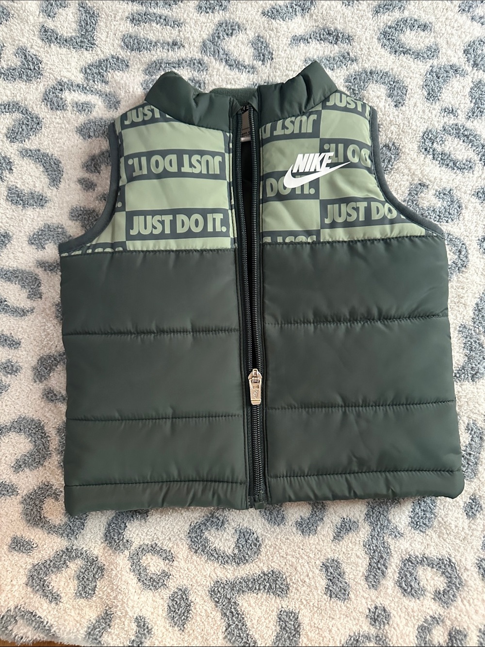 Nike Kids Olive Green Puffer Vest with 'Just Do It.' Panels